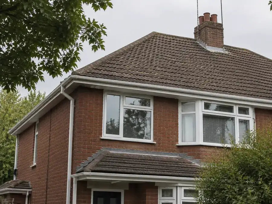 Gutters and downpipe on a semi-detached brick house in Bexley