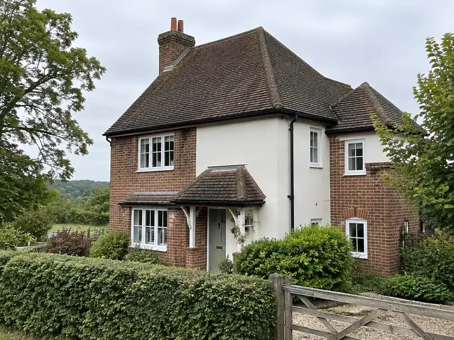 Gutters on a detached house surrounded by trees in Darenth