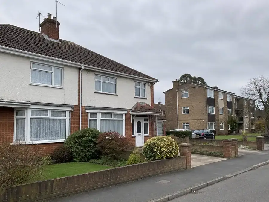 Gutters on a semi-detached house and a block of flats in Swanley
