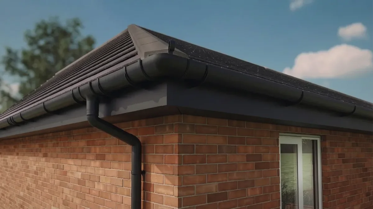 Gutter and downpipe on a brick house